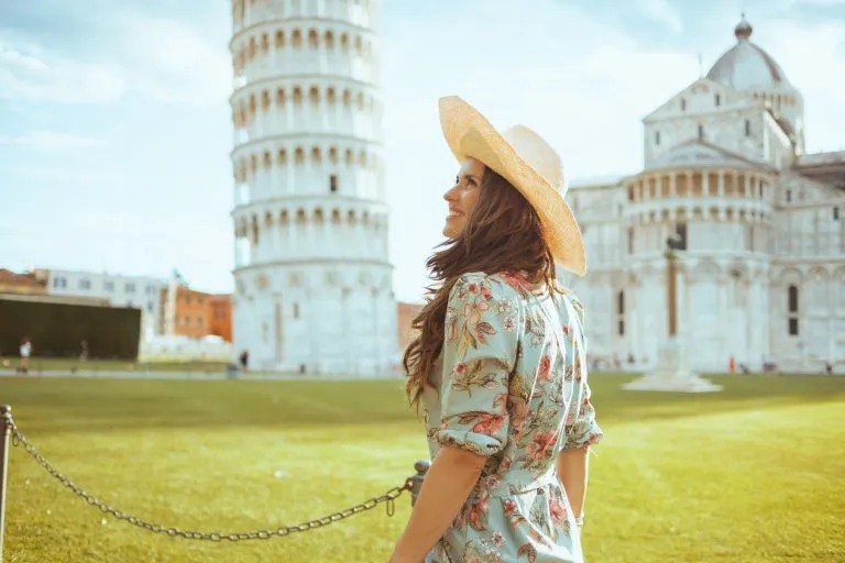 smiling woman in floral dress exploring attractions