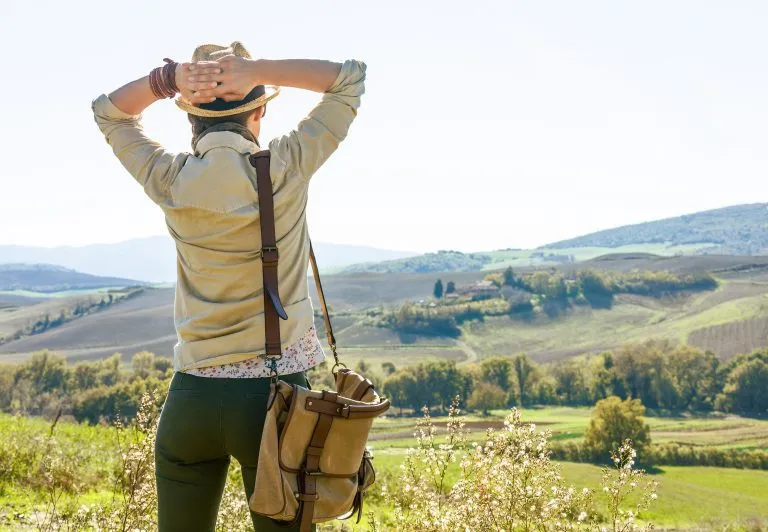 relaxed adventure woman hiker hiking in Tuscany